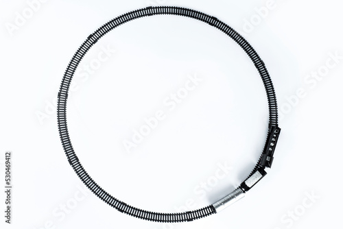 The toy train runs on the rails. take from above on white background