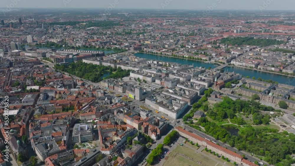 Cityscape with curving line of lakes around city centre. Aerial view of metropolis from height. Copenhagen, Denmark Cityscape with curving line of lakes around city centre. Aerial view of metropolis from height. Copenhagen, Denmark