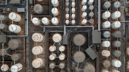 Aerial view chemical storage tank on sea at oil terminal station, Chemical plant petroleum and petorchemical product, Chemical industry plant in refinery.