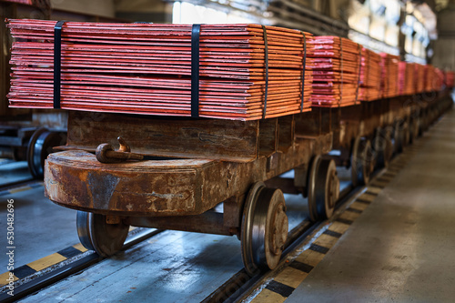 Fotografie Cathode copper sheets on rail carriages in warehouse
