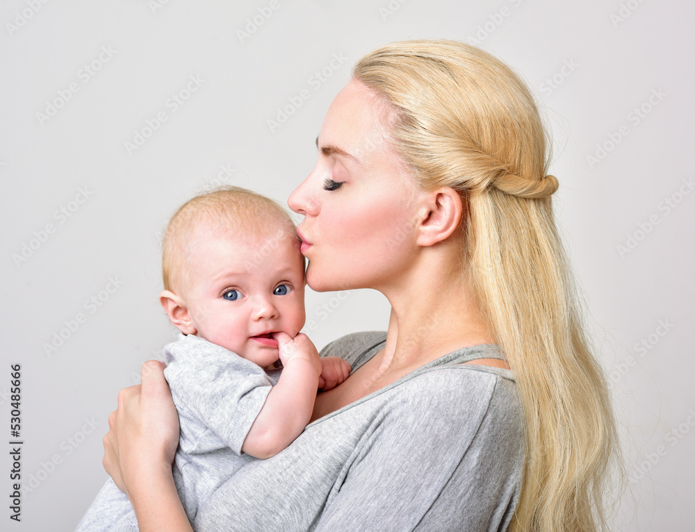 Mother and baby playing and smiling. Happy family. Mother and baby playing and smiling. Happy family.