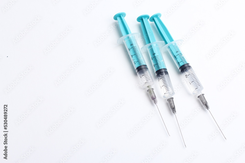 Medical syringe on a white background. A syringe for injection. The concept of health and beauty Medical syringe on a white background. A syringe for injection. The concept of health and beauty