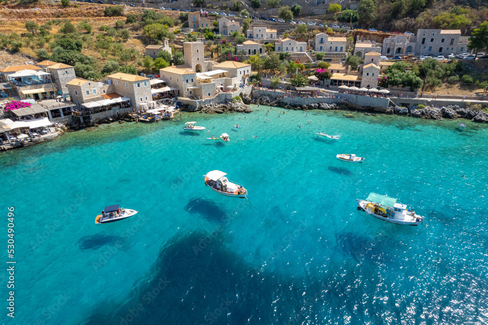 Aerial panoramic photo of Limeni the picturesque villlage with the turquoise waters and the stone buildings under Areopoli, peloponnese , Greece.