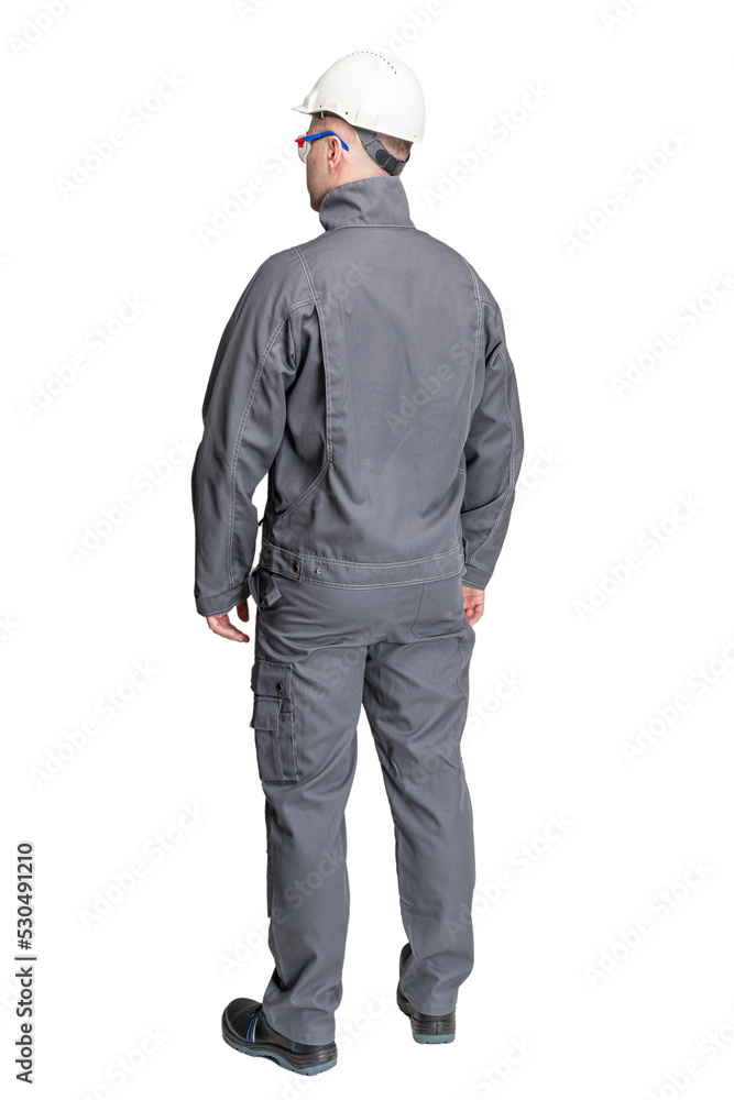 a man in special clothes for workers in a helmet on a white isolated background a man in special clothes for workers in a helmet on a white isolated background
