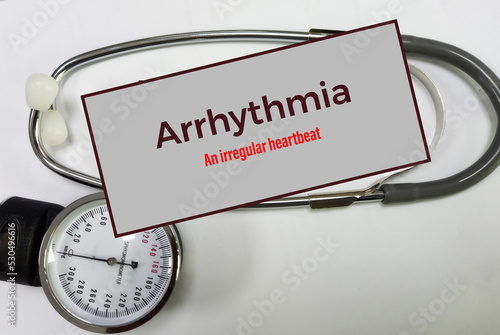 Cardiac arrhythmia disease awareness poster with stethoscope. Irregular heart rhythms concept, Medical concept. photo