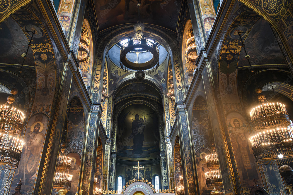 Obraz premium Interior of the famous St. Volodymyr Cathedral with icons and painting frescoes on the wall in Kyiv, Ukraine
