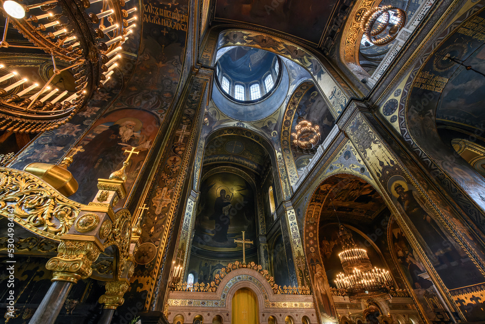 Interior of the famous St. Volodymyr Cathedral with icons and painting frescoes on the wall in Kyiv, Ukraine