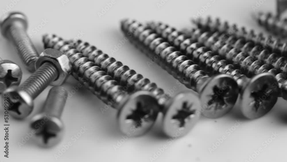 Close-up of long nails, on a gray background. Building a house. A poster for a building materials store or catalog. Close-up of long nails, on a gray background. Building a house. A poster for a building materials store or catalog.