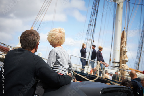 a family watching the tall ship race in Aalborg