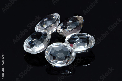 Natural gemstone white topaz on black background