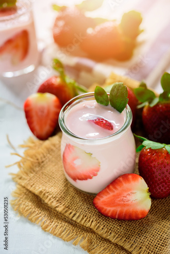Healthy food of yogurt, Strawberry Yogurt,yogurt with fresh strawberry, wood background