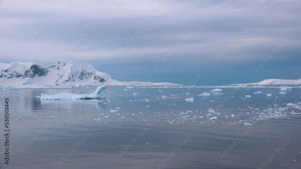 Antarctic landscape with mountains and icebergs. The beauty of the nature of planet Earth. Antarctic landscape with mountains and icebergs. The beauty of the nature of planet Earth.