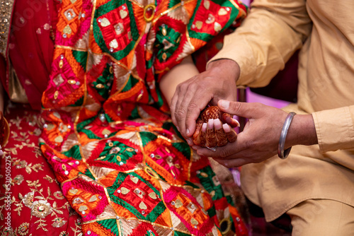 Indian Punjabi choora ceremony hands and bangles close up