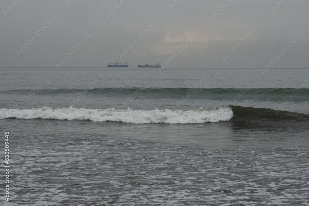 Morning view on Air Manis beach, West Sumatra with overcast sky. Air Manis Beach is closely related to the legend of Malin Kundang