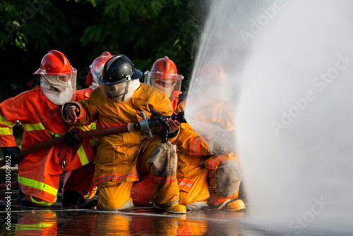 Firefighters are practicing firefighting plans are putting out a burning fire