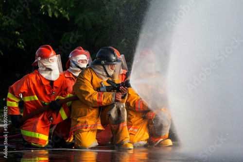 Firefighters are practicing firefighting plans are putting out a burning fire