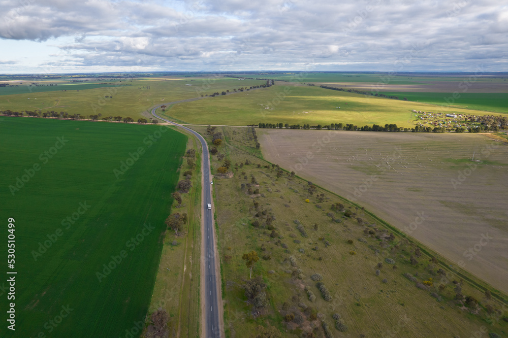 Looking down on farmland with wheat, canola and other grain crops.