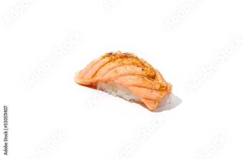 Baked salmon sushi isolated on white background Simple sushi with fresh salmon fillet in minimal style. Japanese food - susi with burnt salmon and rice. Nigiri sushi with fish