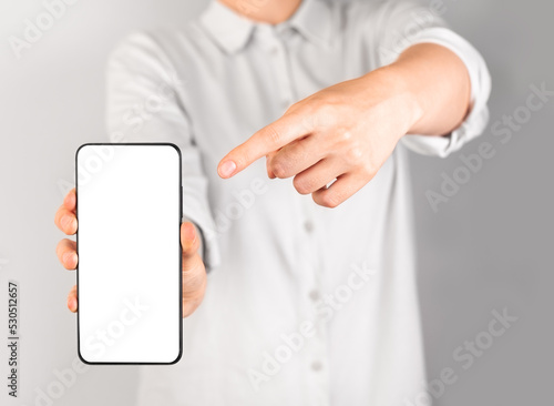 Obraz na plátně Woman forefinger pointing to phone mockup