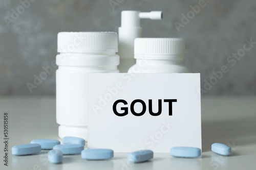 Doctor keeps a card with the name of the diagnosis - gout. Selective focus. Medical concept.