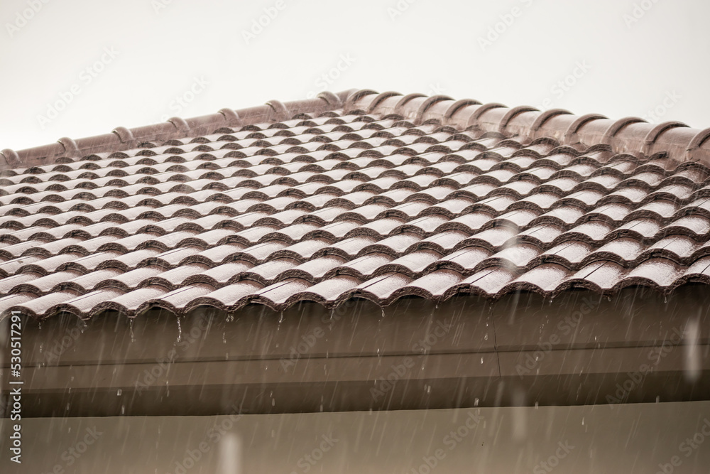 Fototapeta premium rain falling down from the house roof
