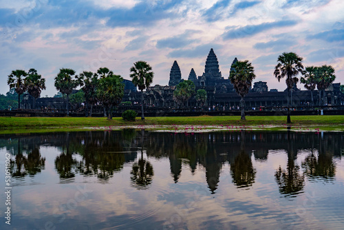 Cambodia. Siem Reap Province. A silhouette of Angkor Wat (Temple City) and its reflection in the lake at early morning. A Buddhist and temple complex in Cambodia and the largest religious monument in