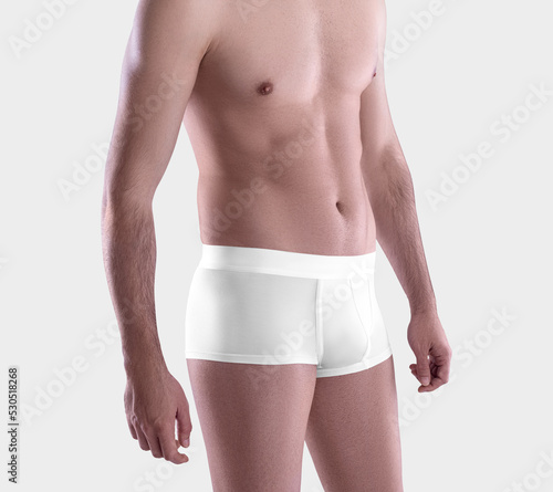 Mockup of white male trunks on a guy, brief underpants close-up, for design, pattern, advertising, front, side view.