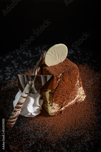 Traditional italian dessert tiramisu on blake plate.