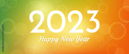 Happy new year 2023 incription on blurred background