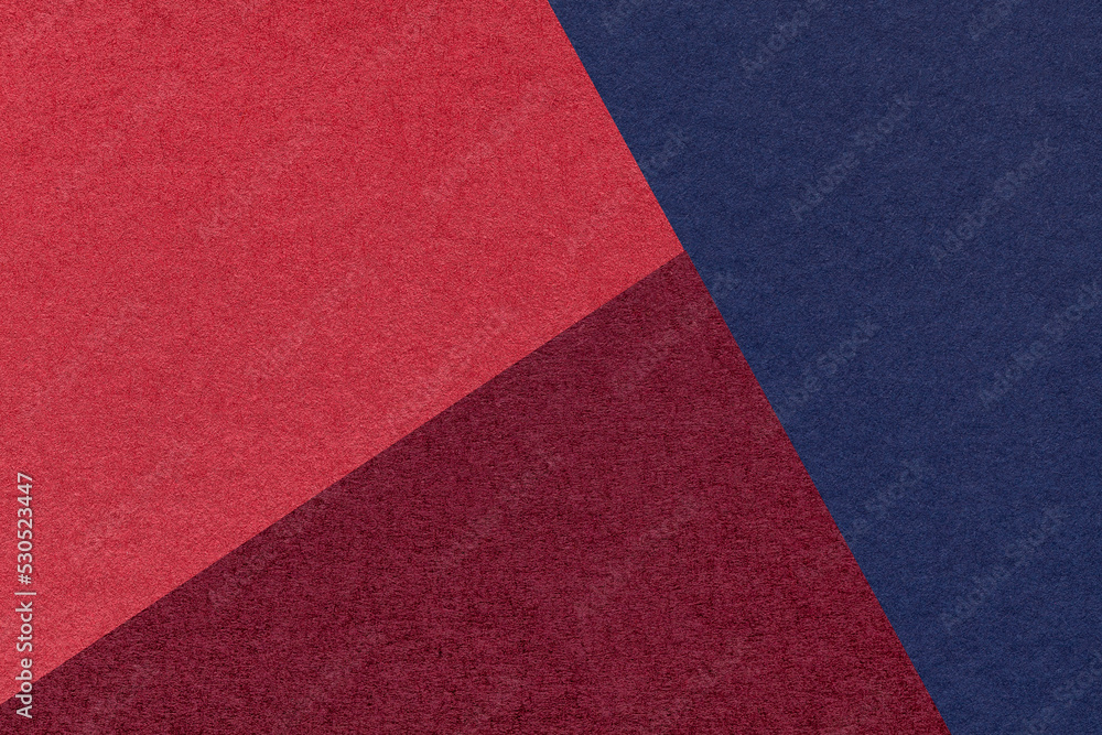 Fototapeta premium Texture of craft navy blue, wine and red shade color paper background, macro. Vintage abstract cardboard