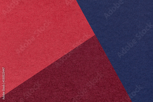 Texture of craft navy blue, wine and red shade color paper background, macro. Vintage abstract cardboard