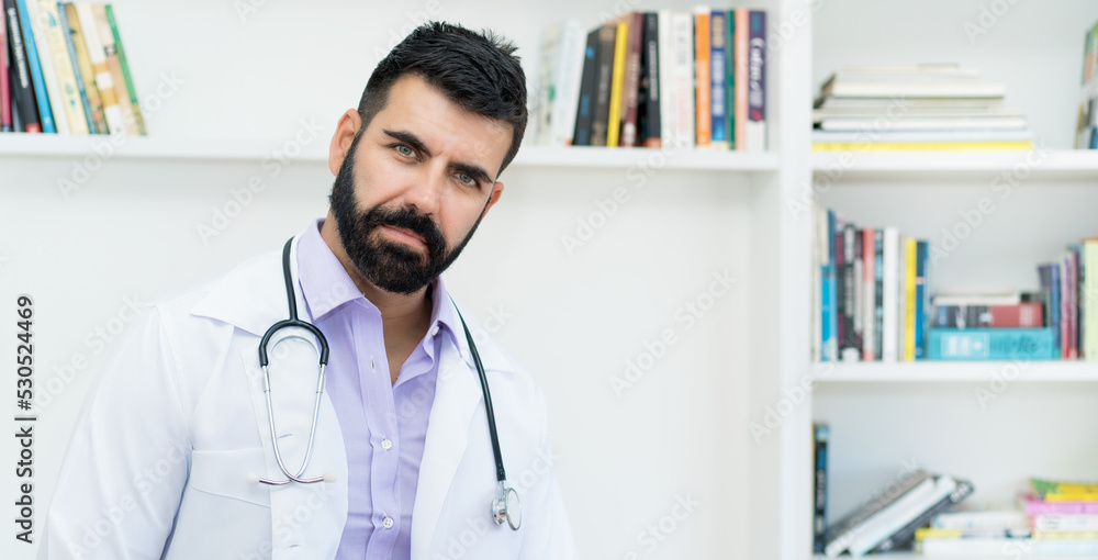Serious hispanic mature doctor with beard Serious hispanic mature doctor with beard