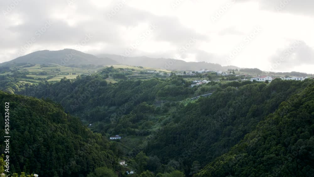 Beautiful Landscape of the Azores with Green Forest and Houses on Hill Beautiful Landscape of the Azores with Green Forest and Houses on Hill