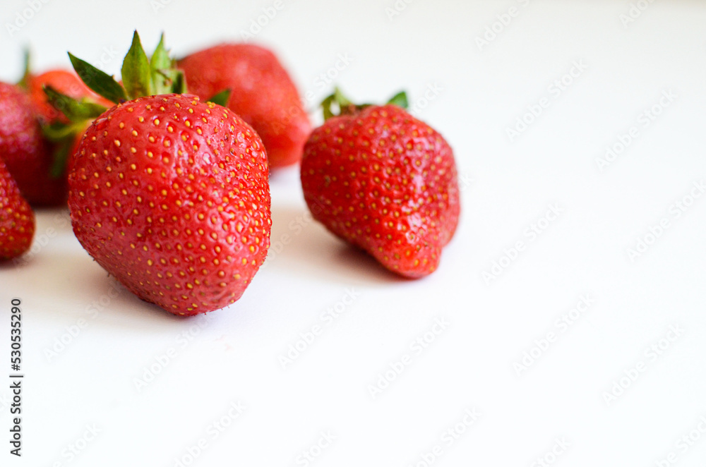 Three strawberries with strawberry leaf on white background. Three strawberries with strawberry leaf on white background.