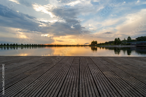 Dramatic sunset and reflections on the water on Patriot Lake in Shelby Farms Park, Memphis, TN.