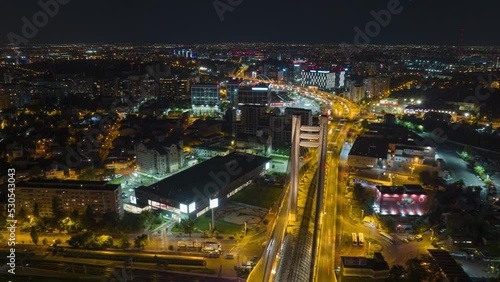 Bucharest City Traffic Driving In The Streets And Illuminated Basarab Overpass Bridge At Night In Romania. - aerial hyperlapse photo