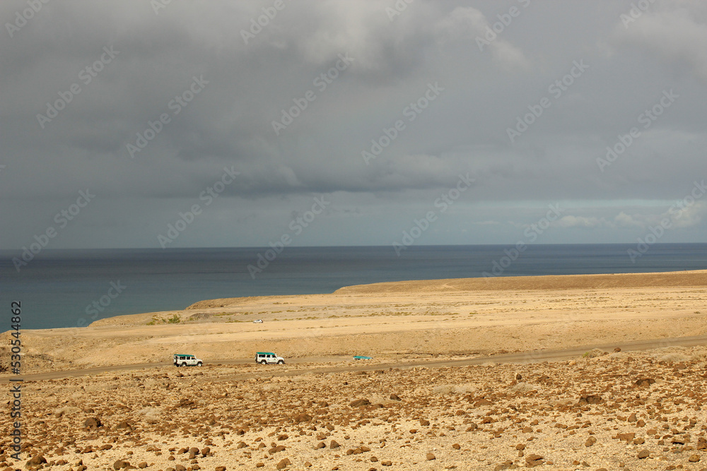 Road on the coast of the Atlantic Ocean, Canary Islands. Fuerteventura island, Spain Road on the coast of the Atlantic Ocean, Canary Islands. Fuerteventura island, Spain