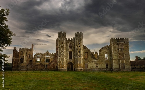 Scenic view of the magnificent Cowdray Heritage Ruins against a gloomy sky in Midhurst, England photo