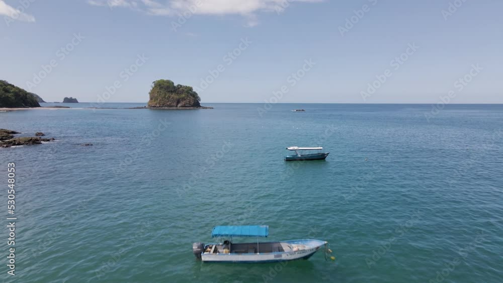 Aerial Pan Forward Over Two Small Fishing Boats, Static In The Ocean, Anchored Down Aerial Pan Forward Over Two Small Fishing Boats, Static In The Ocean, Anchored Down