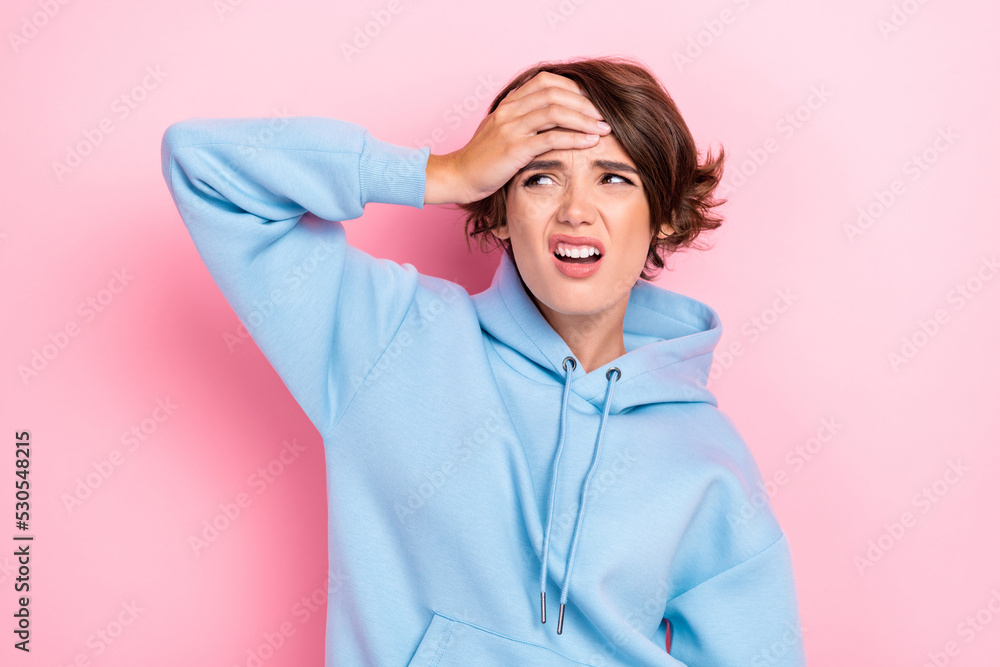 Photo of young adorable gorgeous nice woman wear blue hoodie unhappy touch head pain ache stressed isolated on pink color background Photo of young adorable gorgeous nice woman wear blue hoodie unhappy touch head pain ache stressed isolated on pink color background