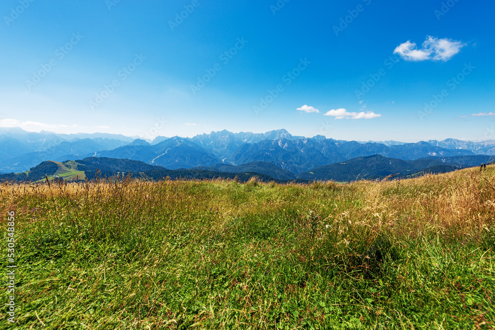 Panorama of Julian Alps from the Carnic Alps (mountain peak of Osternig or Oisternig). Italy Austria border, Europe. Tarvisio, Udine province, Friuli Venezia Giulia.