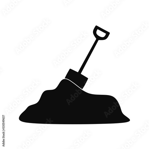 shovel vector in a pile of sand