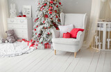 Interior with Christmas tree, armchair, crib
