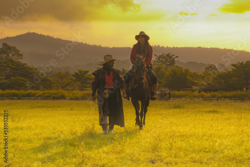 Fototapeta Naklejka Na Ścianę i Meble -  cowboy riding horse.Silhouette cowboy on horseback.