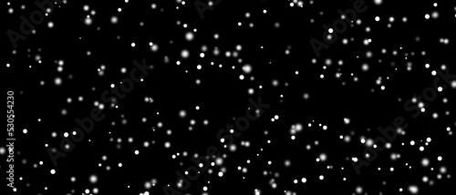Snowfall bokeh on black background. Many snowflakes in flying in the air. Winte night snowfall and blizzard of snow at. Blur bokeh light effect creative background