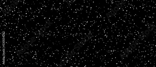 Snowfall bokeh on black background. Many snowflakes in flying in the air. Winte night snowfall and blizzard of snow at. Blur bokeh light effect creative background
