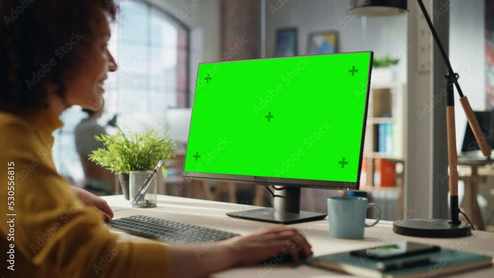 Confident Arab Businesswoman Working on Implementing Modern Business Strategy in Creative Agency. Specialist Writing Corporate Project Plan on Desktop Computer with Green Screen Mock Up Display.