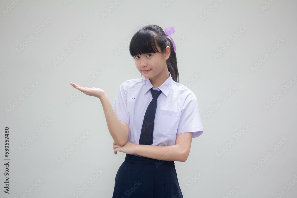 Portrait of thai Junior high school student uniform beautiful girl show hand Portrait of thai Junior high school student uniform beautiful girl show hand
