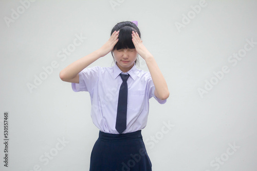 Portrait of thai Junior high school student uniform beautiful girl Think