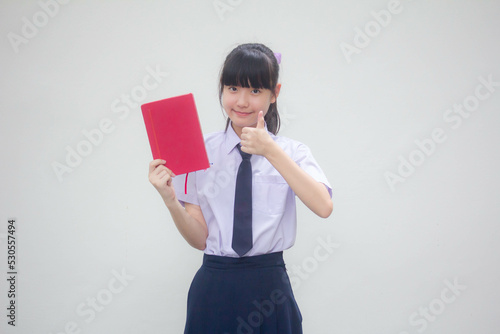 asia thai Junior high school student uniform beautiful girl show a book